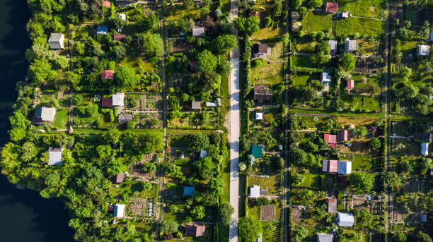 Tiny Ecological Friendly City Plot Gardens on Lake Edge, Aerial Top Down View stock photo