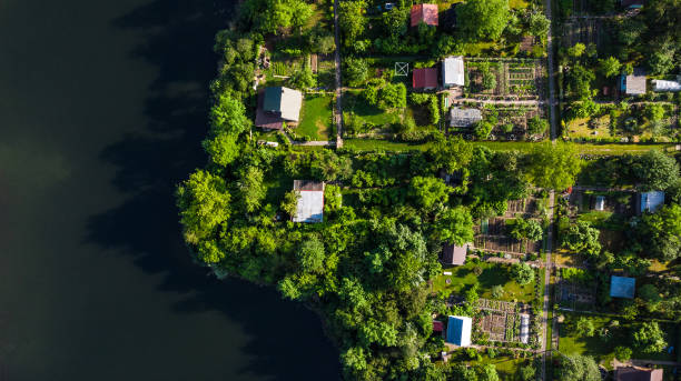 istock Tiny Ecological Friendly City Plot Gardens on Lake Edge, Aerial Top Down View 1157942953