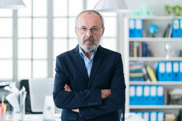 istock Confident senior businessman leader at office 1157946960