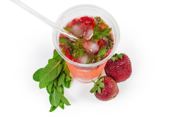 istock Top view cold mint drink with strawberry, mint twigs, berries 1157947026