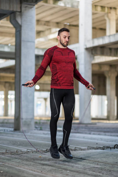 istock Sportsman jumping ropes 1157947123