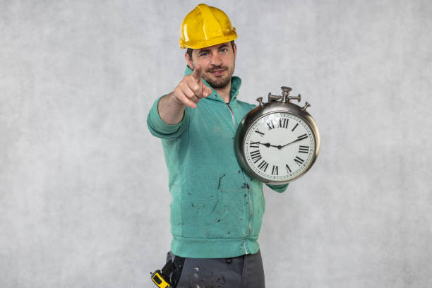 istock concept of time in matters of construction, builder and clock 1157947373