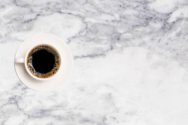 istock coffee cup, top view of coffee cup on marble table background 1157947492