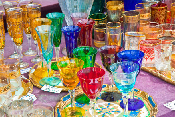istock Old colored glasses in an italian flea market. 1157948371