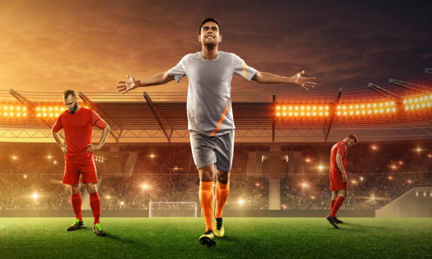 istock Soccer player on a stadium celebrates victory after the game 1157949666