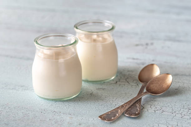 istock Two jars of Greek yogurt 1157951256