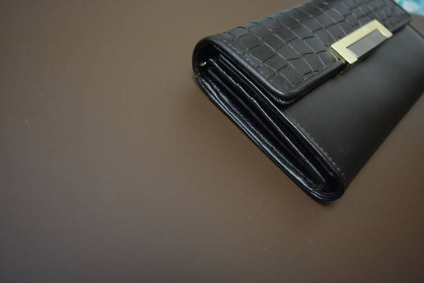 Black leather wallet isolated on the white background.