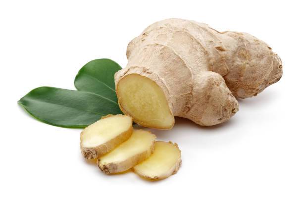 istock Ginger root with slices and leaves isolated 1157952776