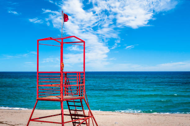istock Red rescue tower on the beach 1157957459