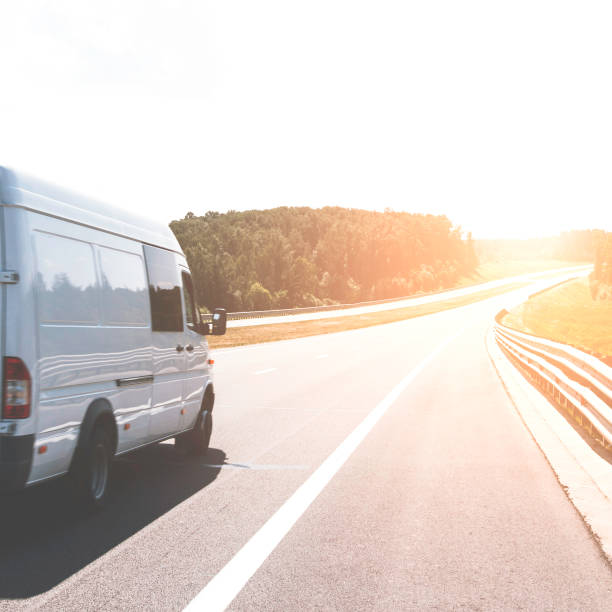 istock White minibus on the highway. Cargo concept 1157957918