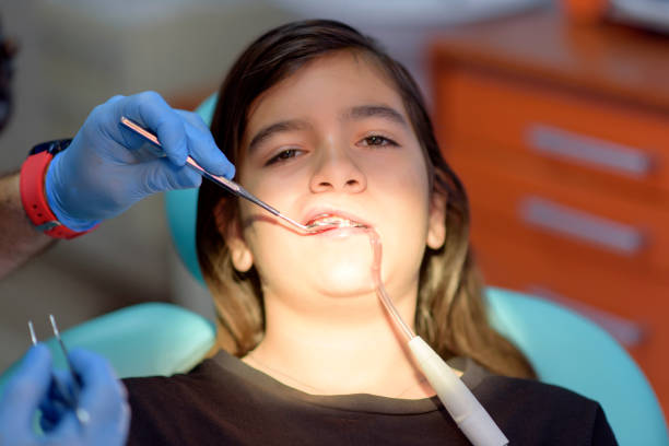 istock girl in dental office 1157958093