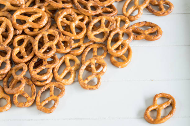 istock heap mini pretzel snack with salt, white background 1157958929