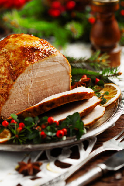 istock Christmas baked ham, served on the old plate. 1157960183