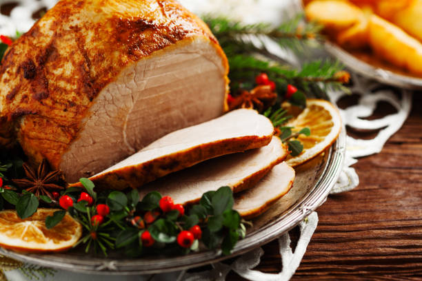 istock Christmas baked ham, served on the old plate. 1157960297