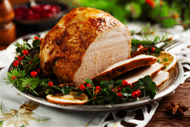 istock Christmas baked ham, served on the old plate. 1157960980