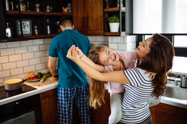 istock Family at home starting their day in the kitchen dancing 1157963401