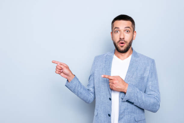 istock Close up photo amazing he him his guy macho cool great proposition hands arms indicating side empty space black friday sale discount wear formal-wear jacket blazer isolated grey background 1157963751