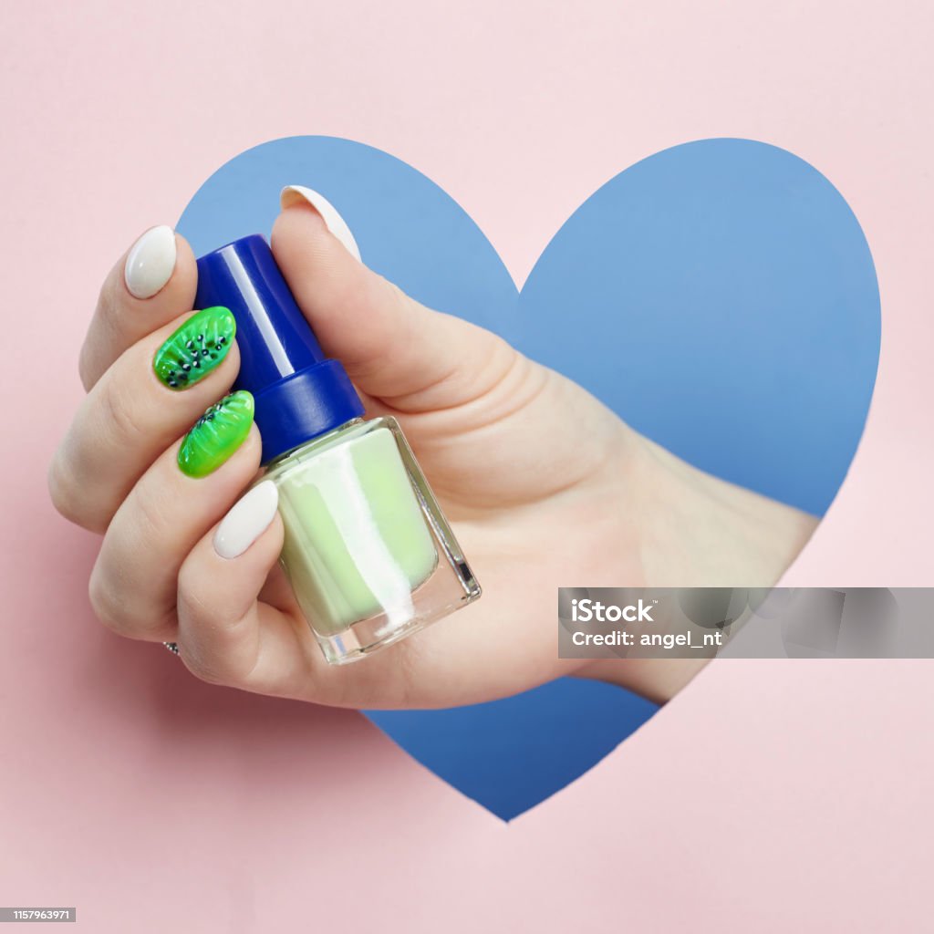 Cosmetics Hand Makeup Beautiful Nails Manicure Nail Polish Advertising On  Colored Paper Background Fingers With Bright Colored Manicure Stock Photo -  Download Image Now - iStock