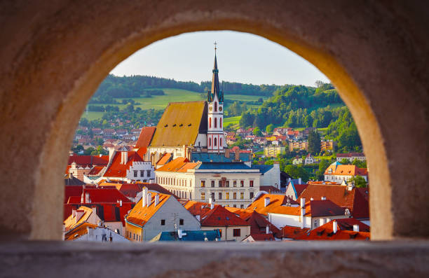 Czech Krumlov Czech Republic view at old town through window with arch. Landmark and traveling.