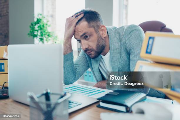 Close Up Photo Handsome He Him His Macho Guy Depressed Epic Fail Project Had No Sleep All Week Hold Head Overwhelmed Day Night Working Look Stressed Notebook Table Sit Office Chair Wear Jacket Blazer Stock Photo - Download Image Now