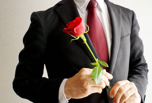 Businessman with red rose flowers.