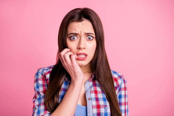 istock Portrait of disappointed depressed terrified hipster fail lose expression grimace good-looking feel dispair touch fingers hands isolated dressed checkered youth clothing pink background 1157968625