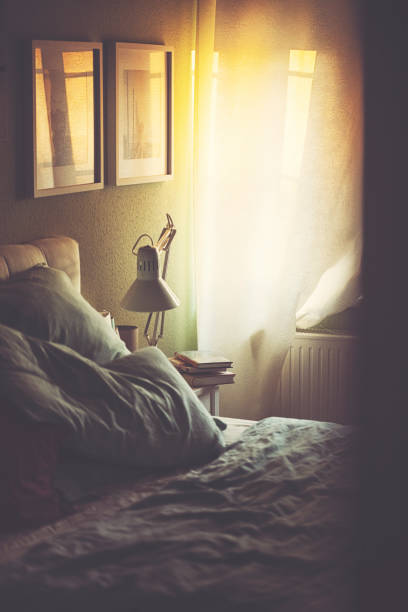 istock View into the sunny bedroom in the back light after sunset 1157970080