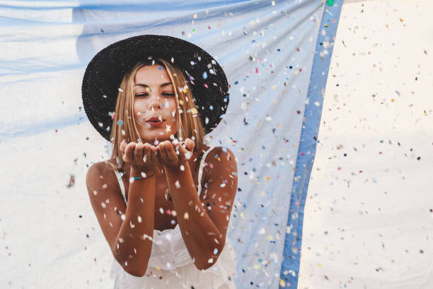 istock pretty woman with colorful straw hat 1157971368