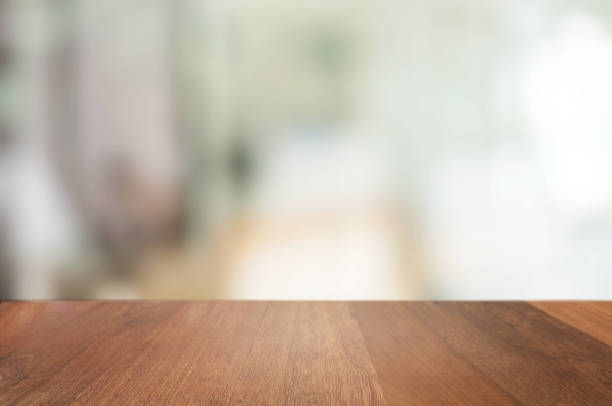 istock empty wood table with blur montage coffee shop or restaurant background. 1157972065