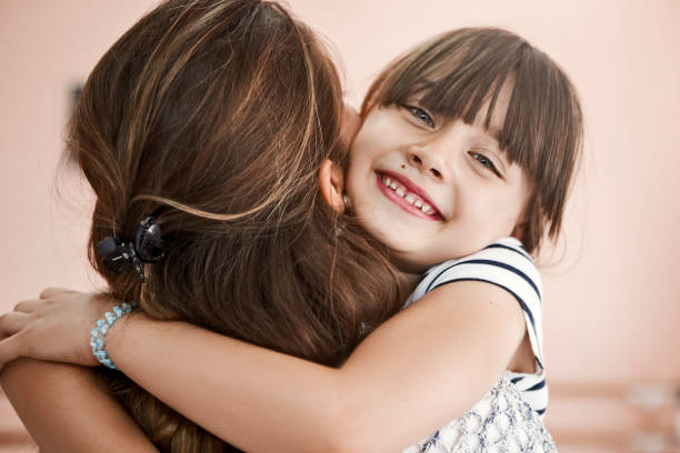 istock Loving mother and daughter hugging 1157972263