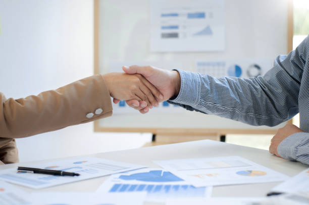 istock Executives consultant hands shaking in conference room. 1157974126