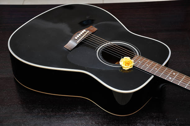 istock A yellow rose displayed with a guitar 1157974800