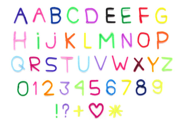 Handformed colorful pipe cleaners letters of the alphabet isolated on white background.