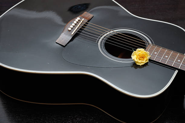 istock A yellow rose displayed with a guitar 1157975598