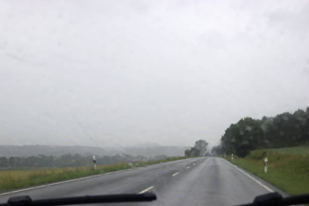 istock blurred vision through the windshield of a car on a rainy day 1157976433