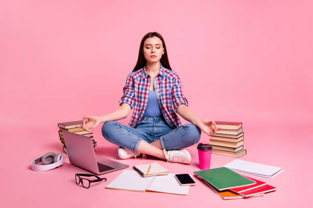 portrait of cute pleasure lady positive close eyes fit train mind serious plaid clothing shirt checked youth gesture isolated pastel background legs crossed folded - om symbol fotos imagens e fotografias de stock