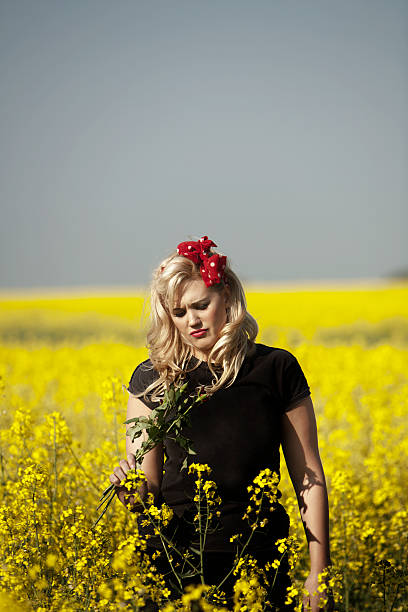 istock young sexy female in a field 115797964
