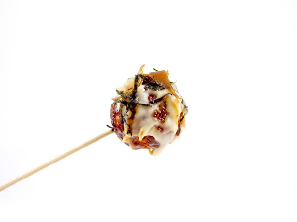 Japanese famous cuisine food takoyaki photo on white backfground Japanese famous cuisine food teriyaki photo on white background cooking takoyaki is a ball shaped japanese snack stock pictures, royalty-free photos & images