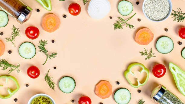 istock Salad ingredients layout. Food pattern with cherry tomatoes, carrot, cucumbers, radish, greens, pepper and spices 1157980206