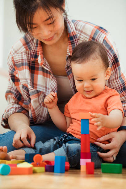 istock Young Child Playing With his Mother 1157980387