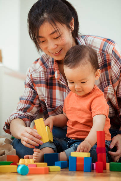 istock Mother and Baby Playing Indoors 1157980389