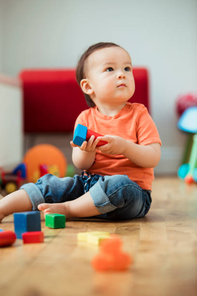 istock A Curious Child Playing Indoors 1157981118