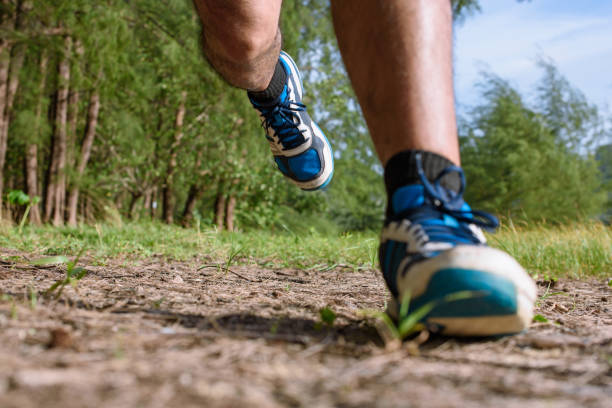 istock The Man running close up legs and feet 1157981243