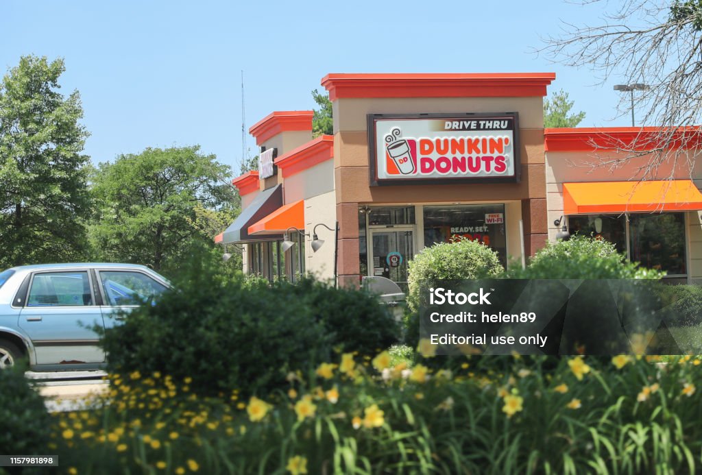 Exterior of Dunkin Donuts shop in  Princeton. Princeton New Jersey - June 23, 2019: Exterior of Dunkin Donuts shop in  Princeton. The company is the largest coffee and baked goods franchise in the world, with 15,000 stores in 37 countries. Bakery Stock Photo