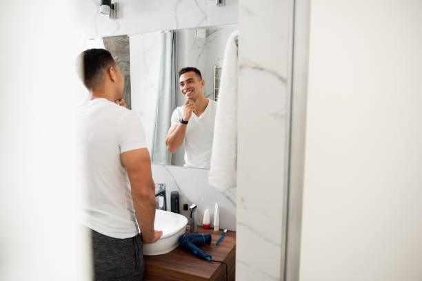 istock Happy satisfied man touching his shaving chin 1157982990