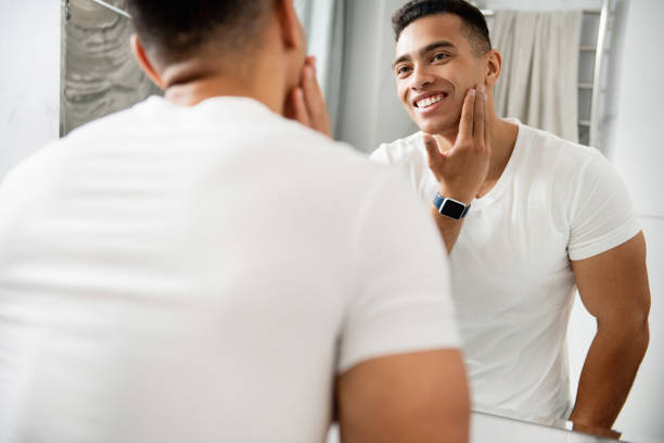istock Happy young man touching his shaving face 1157982996