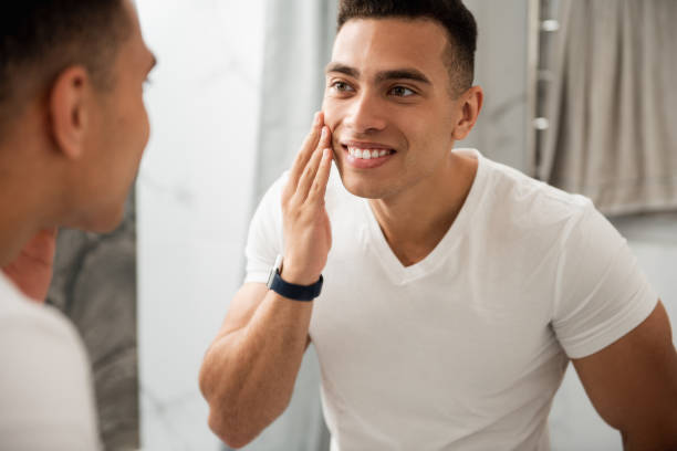 istock Happy man looking at his shaving face 1157982997