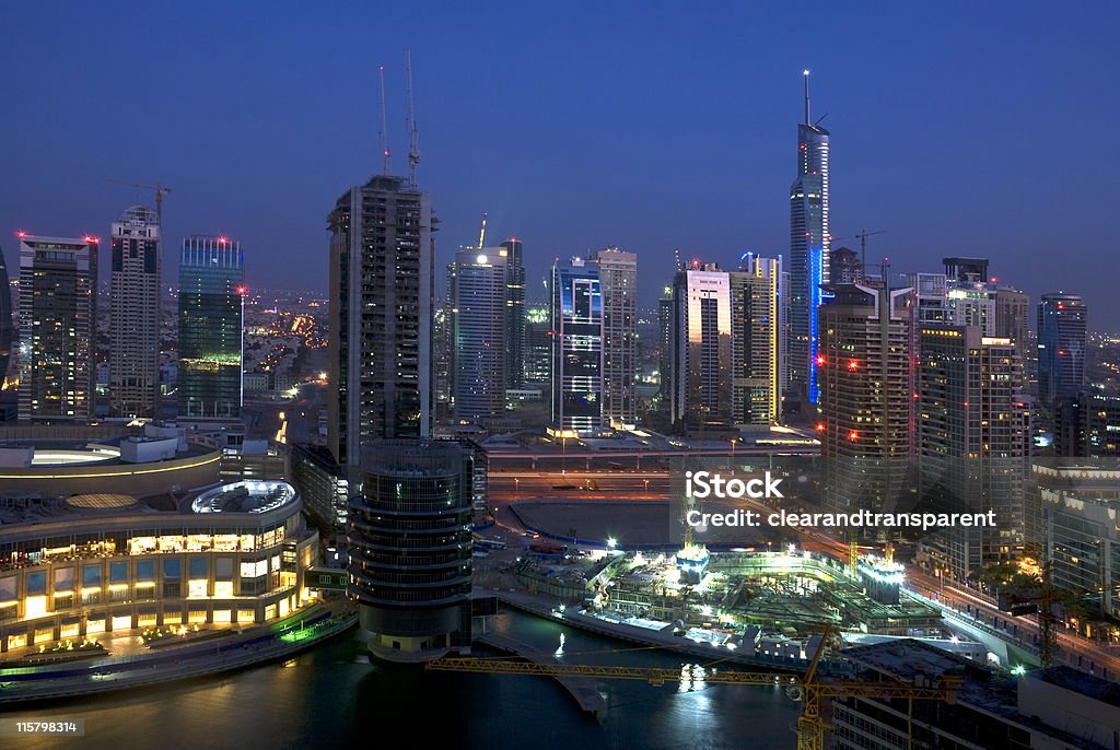 Dubai Marina, United Arab Emirates This is an early evening shot of Dubai Marina, on the left can be seen the new Marina mall and centrally Sheikh Zayed Road and the new monorail, also behind - Jumeirah Lake Towers. Although there are now thousands of people living there, it's still very much under construction. Aerial View Stock Photo