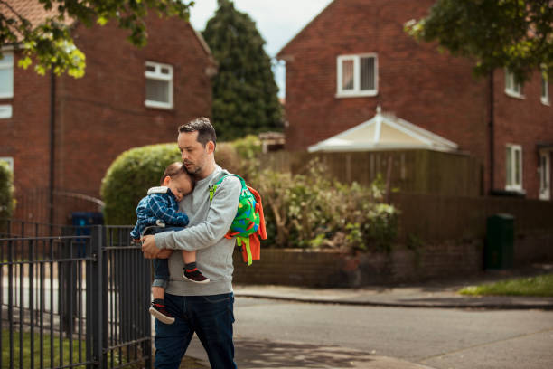 istock Father and Son Enjoying a Relaxing Walk 1157983918