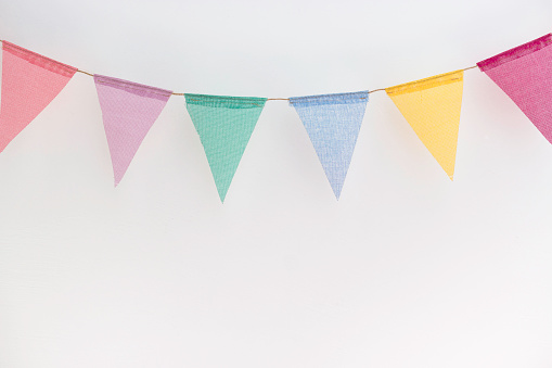 Colorful flag garland isolated on white background. Birthday and celebration concept